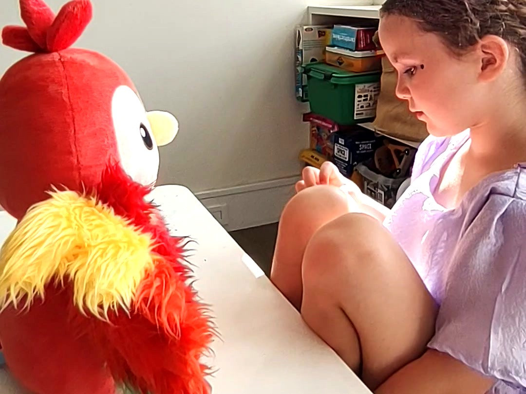 A child listening to her My Phoenyx companion